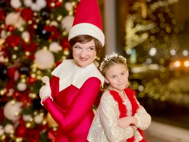 Elf on the Shelf embracing a toddler in a gold sequin outfit near glowing marquee letters