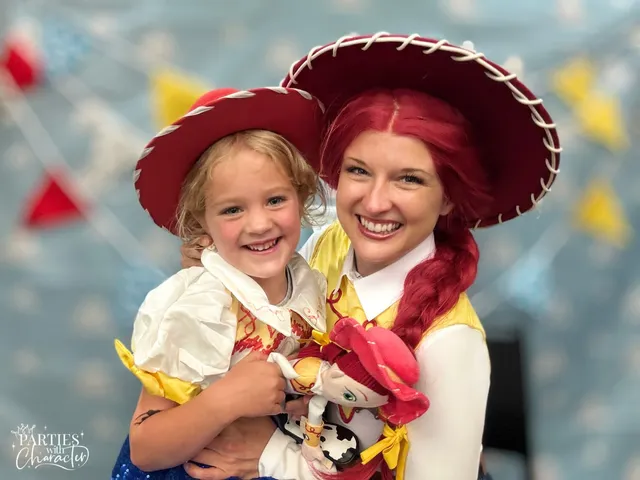 Jessie and a girl in a matching cowgirl costume, hugging a Jessie doll between them