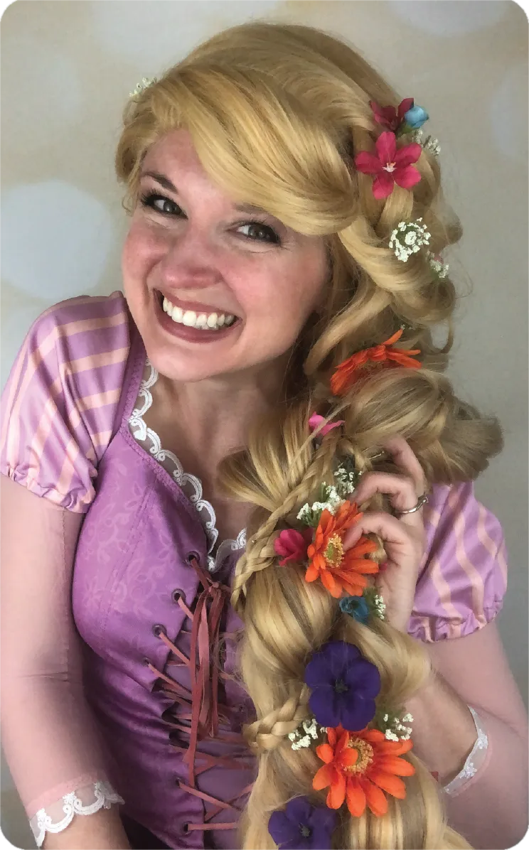 Rapunzel from Tangled with long golden hair in purple gown